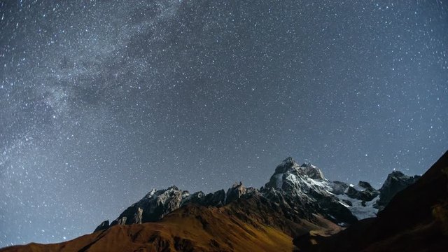 Universe like in hand clearly viewed in late night. Fantasy of nature. 4K Timelapse of night near the Ushba mountain. Georgia. Europe. Caucasus. 