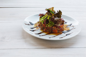 Grilled vegetables salad on white wood