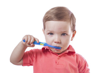 Cute baby boy brushing teeth