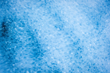 Blue sea wavy shiny glass background