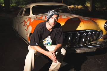 Retro grunge car. Fire auto. evil gangster. Hiphoper.
