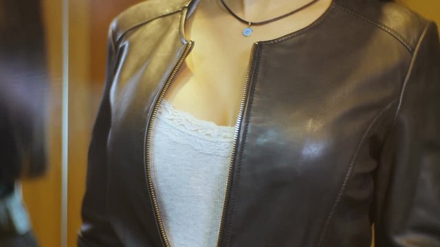 Attractive Model with Big Brasts in Black Leather Jacket