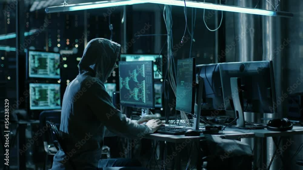 Aufkleber Hooded Hacker Breaks into Corporate Data Servers and Infects them with Virus. His Hideout Place has Dark Atmosphere, Multiple Displays, Cables Everywhere. Shot on RED EPIC-W 8K Helium Cinema Camera.