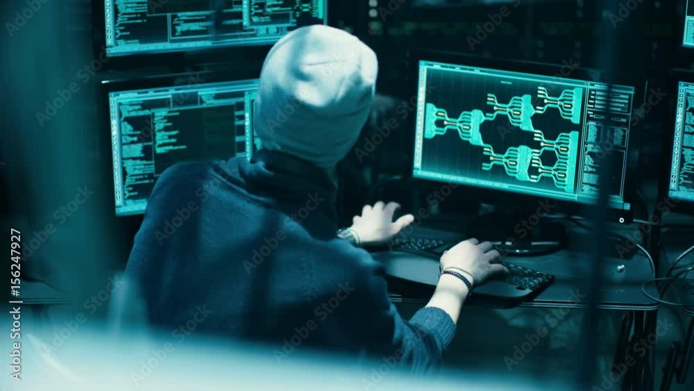 Poster back view of teenage hacker infecting with virus data servers of government. his hideout is dark wit