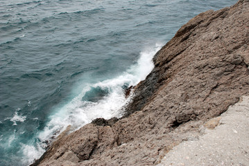 Waves beat against rocks