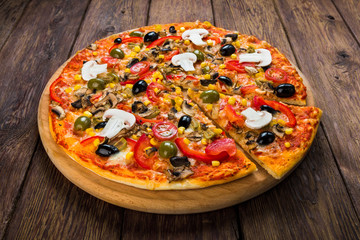 Delicious pizza with salami, mushrooms and olives
