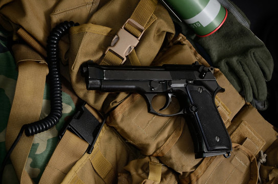 Pistol gun with military equipment.