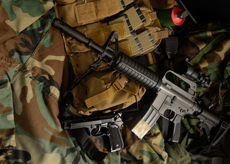 Assault rifle 5.56mm m16 Colt carbine with tactical chest rigs. Military Equipment.