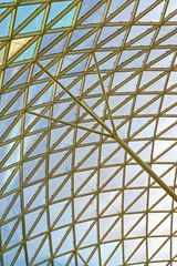 Fototapeta premium Fragment of a roof of shopping center, view from within