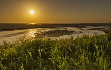 Sunset on the beach with clear skies