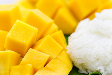 Closeup macro shot of carve beautiful yellow mango with sticky rice