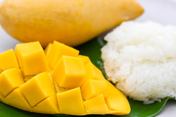 Closeup macro shot of carve beautiful yellow mango with sticky rice