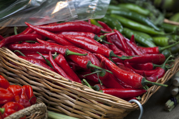 Basket of red chili peppers on Borough market in London