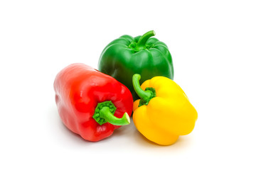 Green, yellow and red fresh bell pepper or capsicum isolated on white background.