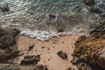 Rocks on the beach with sunlight.