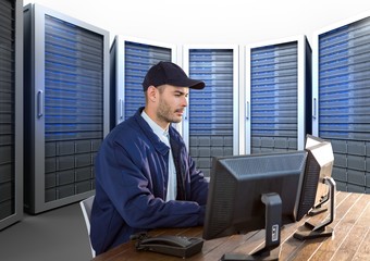security guard working in his office with servitors behind him