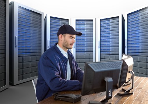 security guard working in his office with servitors behind him