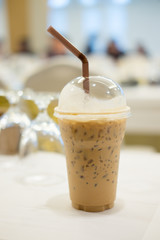 Cold coffee with ice in take away cup