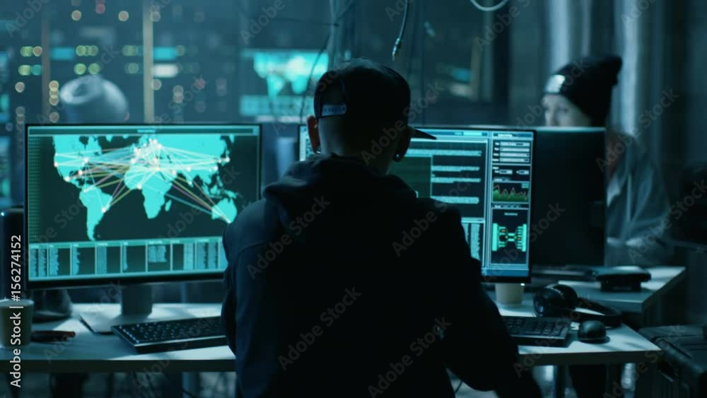 Poster team of internationally wanted hackers teem organize advanced virus attack on corporate servers. pla