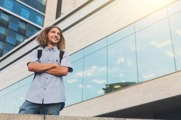 Young man standing at modern office