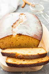 Cinnamon vanilla pound cake on wooden board. 