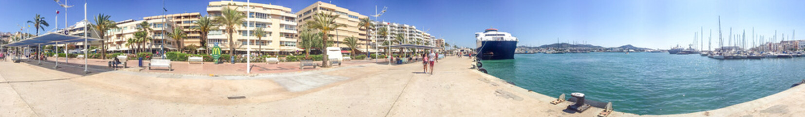 IBIZA, SPAIN - JUNE 2015: Tourists walk in the city port, panoramic view. Ibiza is a famous tourist...