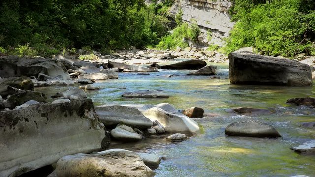quiet waters flowing on stones