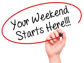 Man Hand writing Your Weekend Starts Here!!! with black marker on visual screen