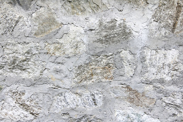 Grunge white concrete and stone wall