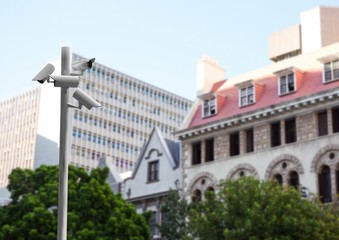 CCTV stick in front of blurred buildings