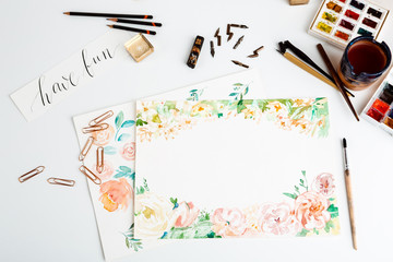 Watercolor paints brushes art details over white background.