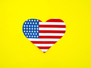 American flag in the shape of a heart on bright yellow background, USA, independence day