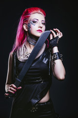 Female model with body painting futuristic on the face and clothes of punk style