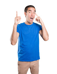 Naklejka premium Shocked young man with a gesture of concentration against white background