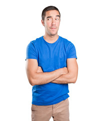 Obraz premium Doubtful young man against white background