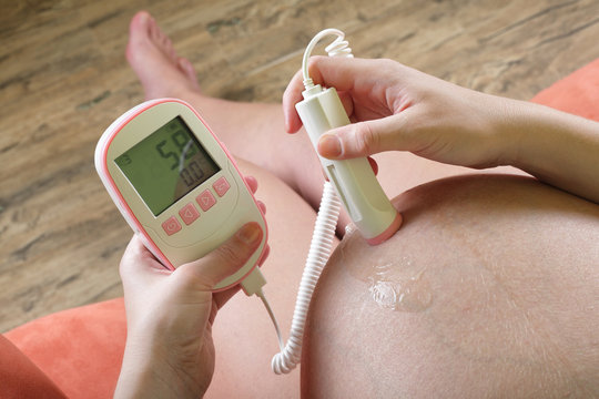 Pregnant Woman With A Fetal Doppler