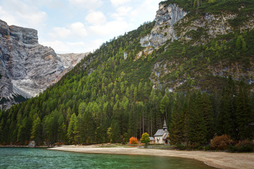 Shapel Marienkapelle at the Braies Lake (Pragser Wildsee) in Dolomites mountains, Sudtirol, Italy