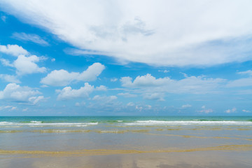 Fototapeta na wymiar Sunny day on th beach. sea beach ,waves ,cloud and blue sky.