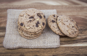 Cookies with milk on a wooden floor