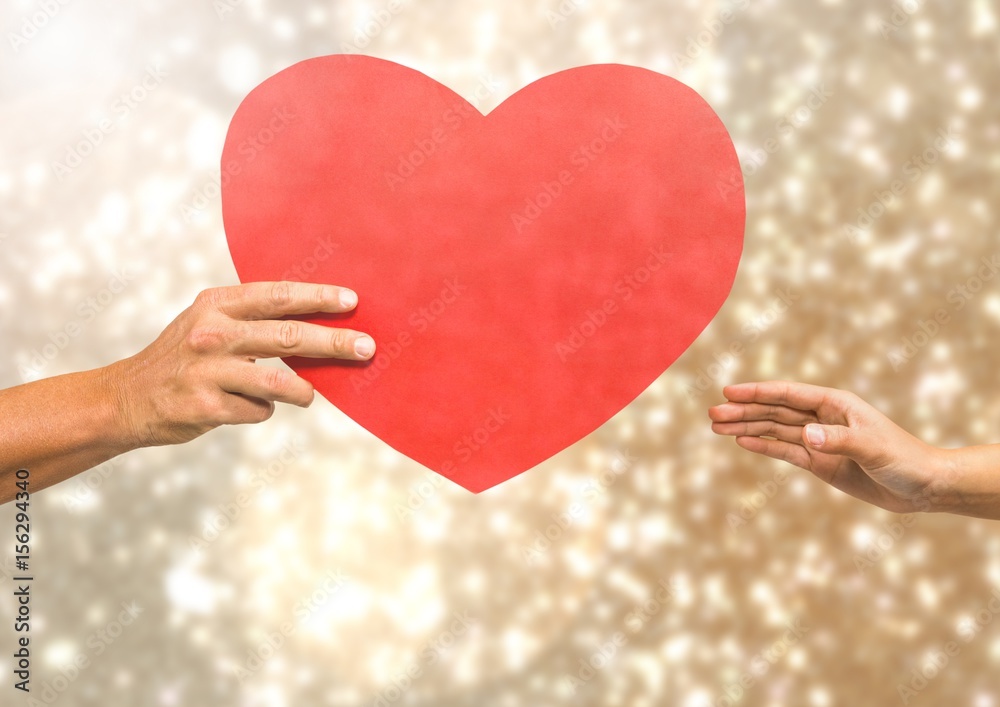 Poster Hands holding heart with sparkling light bokeh background