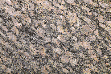 Texture of granite stone is red-gray