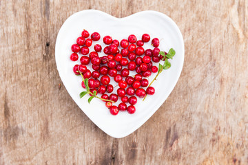red forest cranberries heart plate wood