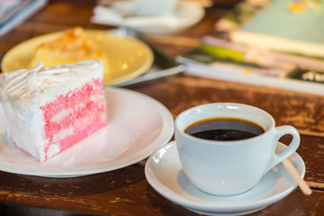 A cup of  coffee and cake.