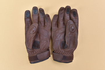 Tan brown leather gloves for riding a motorcycle or bicycle