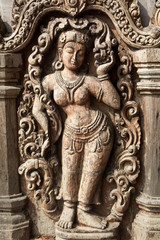 Fototapeta na wymiar Details of Sanctuary of Truth temple (Prasat Satchatham),handmade reliefs and sculptures, Pattaya, Thailand