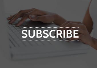 Subscribe text against hands on laptop with dark overlay