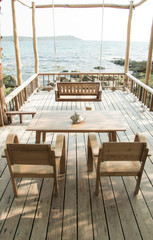 Wooden chair to sit and watch the beautiful sea.