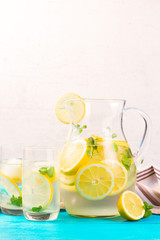 Lemonade homemade drink - jar and glasses on table