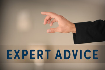 Male hand with finger pointing on blurred background