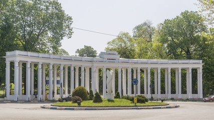 The architecture with white columns at the entrance to the city park Parcul Nicolae Romanescu,...